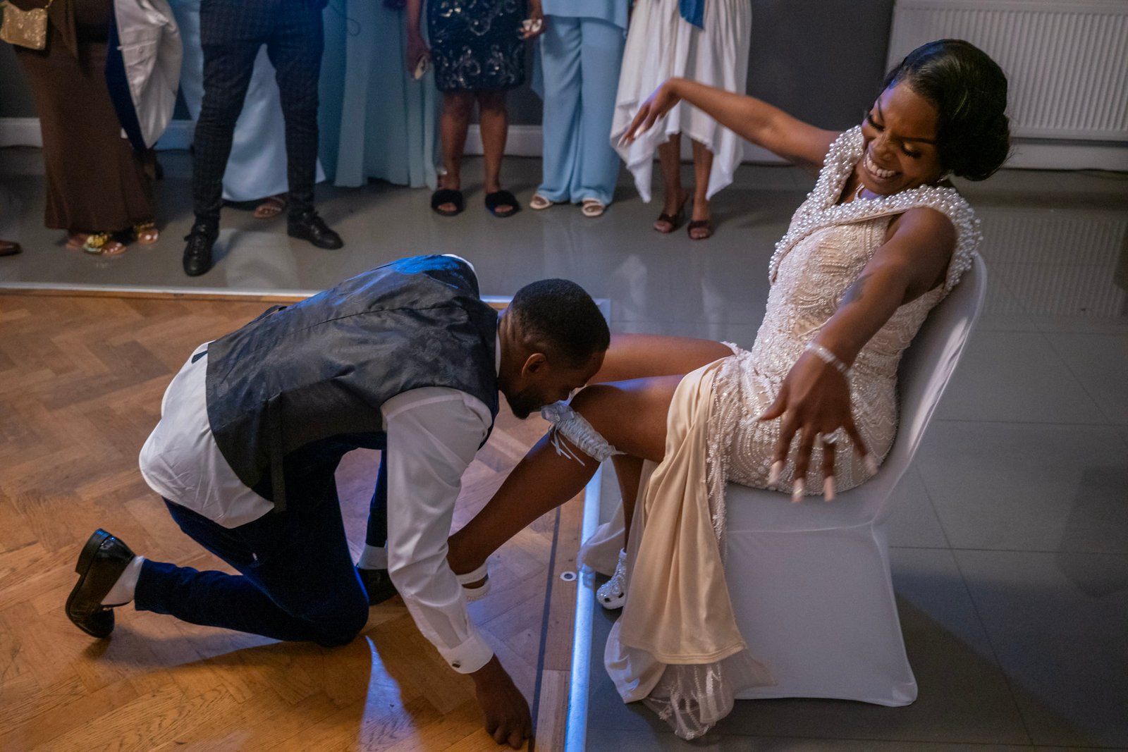 A bride and groom sharing a playful reception moment