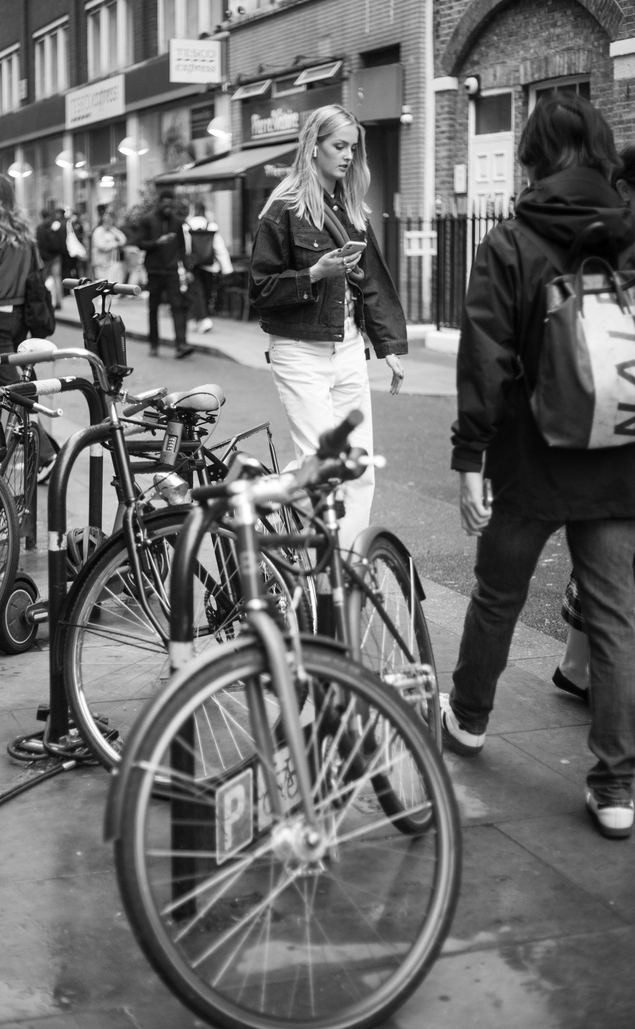 Bicycles and pedestrians on a busy city street