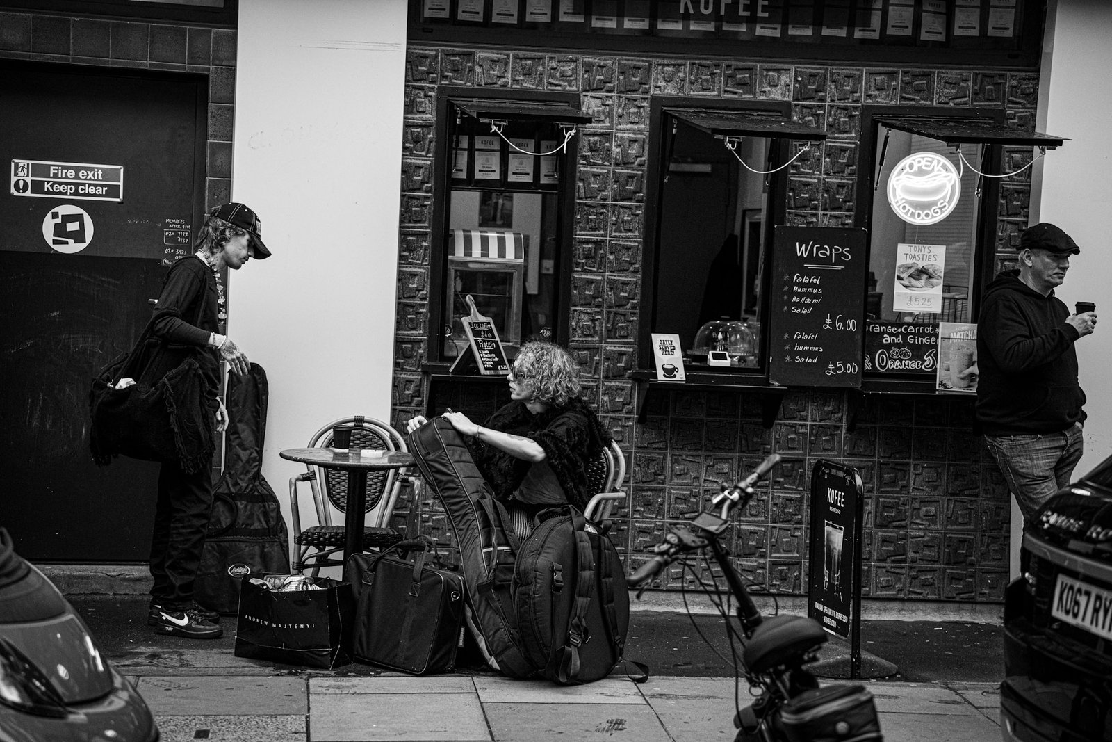 Street musician performing outside a pub