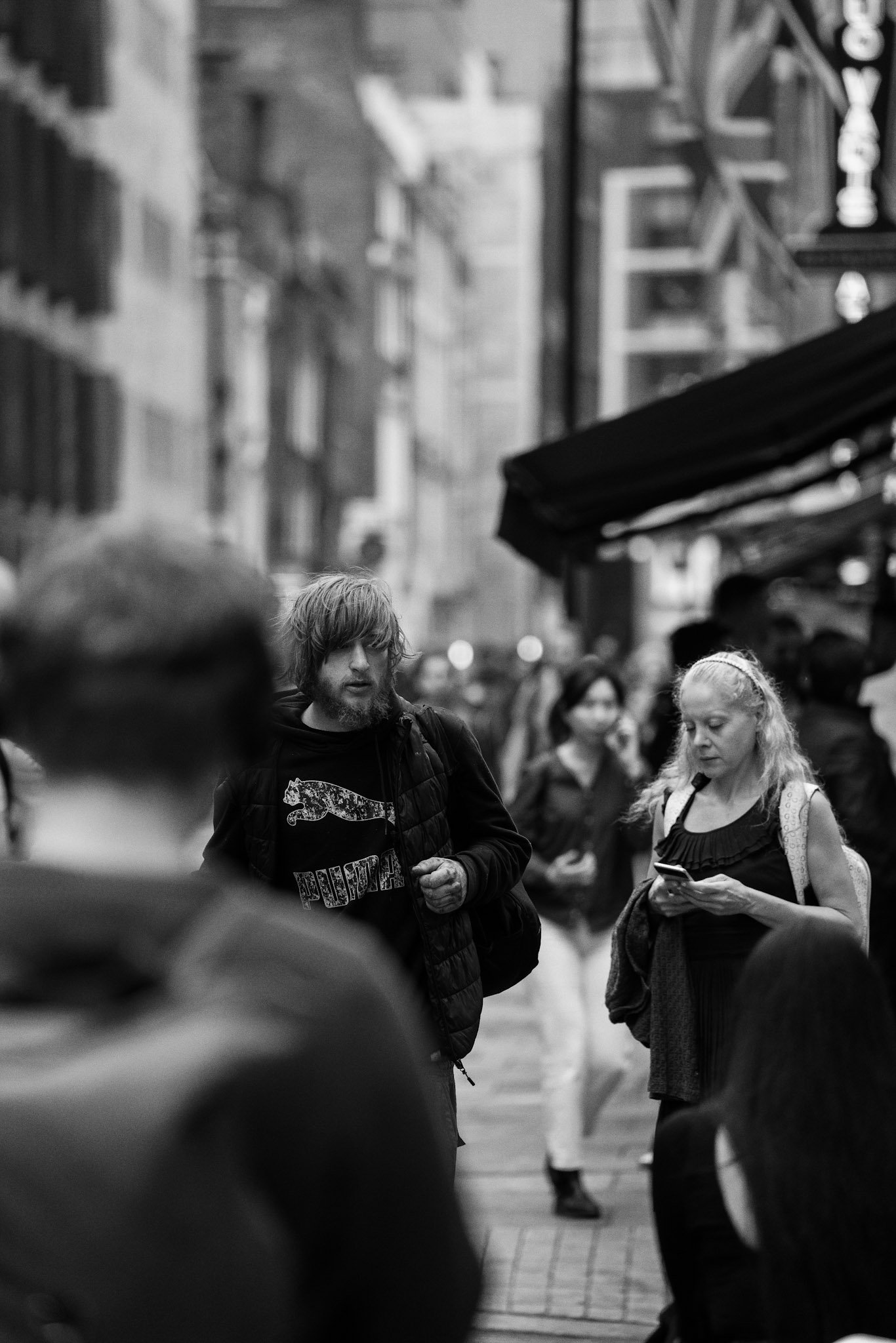 People gathered on a narrow city street