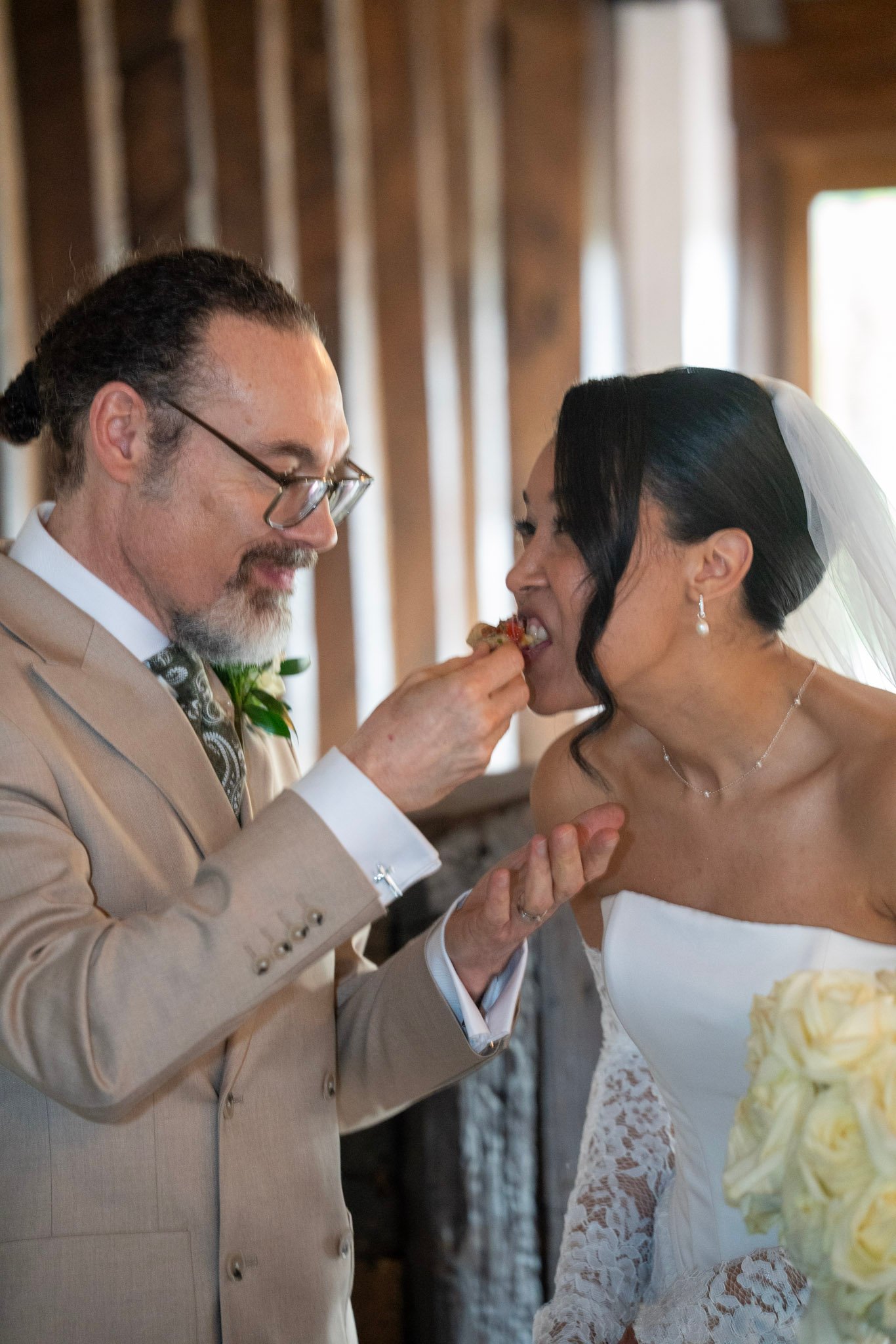 Groom touching bride's face