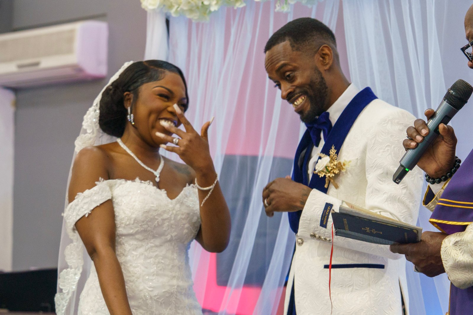 Bride and groom laughing during their ceremony