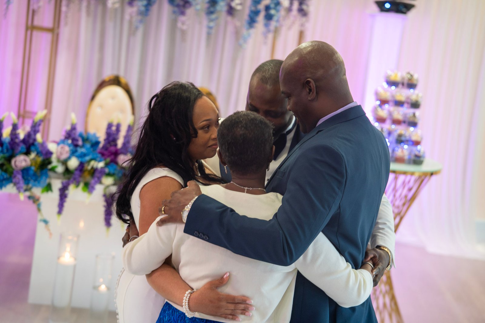 Guests embracing at a wedding