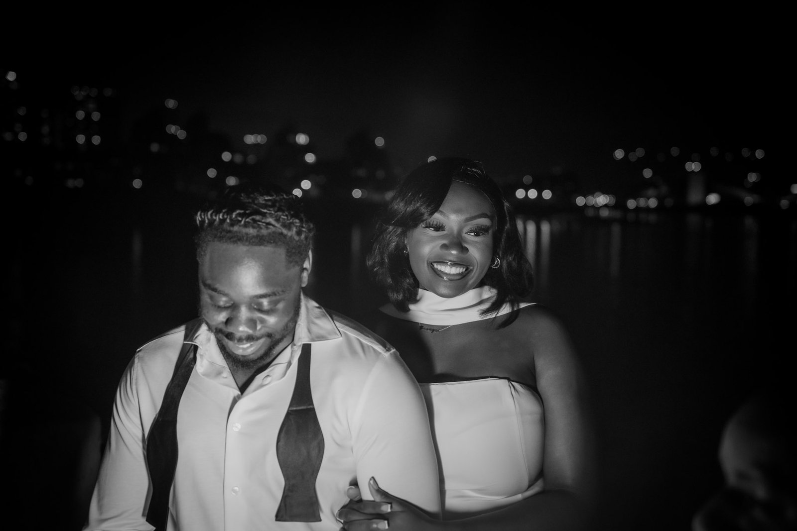Bride and groom smiling at night